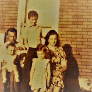 Dad, Al at eight years old, Mom, Jim a baby, and me at three on the back stoop of our old house in Ashland, Oregon