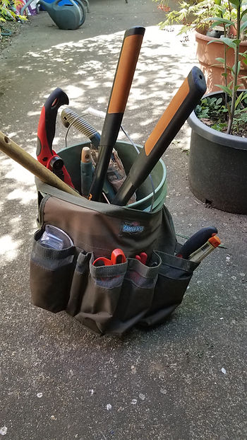 My gardener's bucket with a holster/wrap of tool pockets.