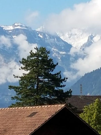 Very impressive mountains with vast snowfields hover over the town of Frutigen.