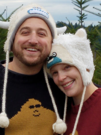 Owyn and wife wearing yeti winter hats and yeti sweaters.